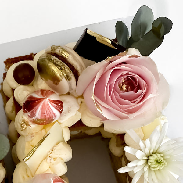 Cake, macarons, roses and meringues