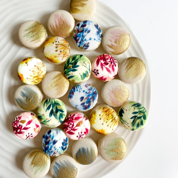 Each macaron is carefully painted by hand according to your theme and colour scheme