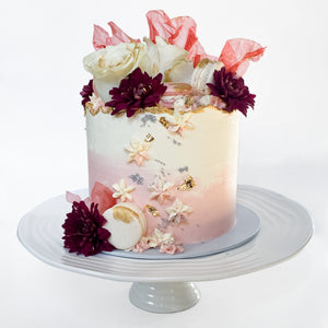 Blooming floral pink ombre cake with macarons